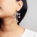Elegant silver oxidized long earrings with intricate patterns and vintage-inspired charm