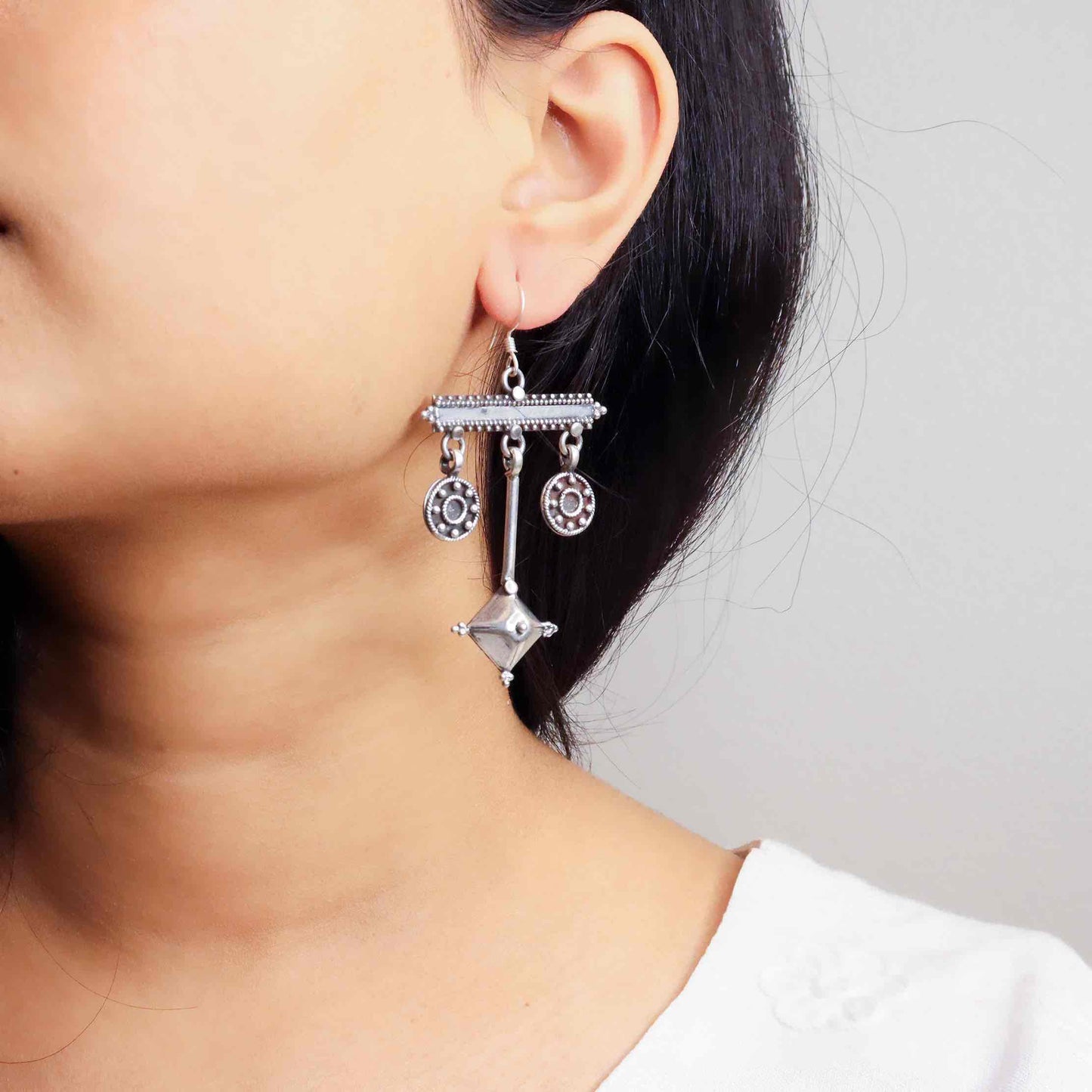 Elegant silver oxidized long earrings with intricate patterns and vintage-inspired charm