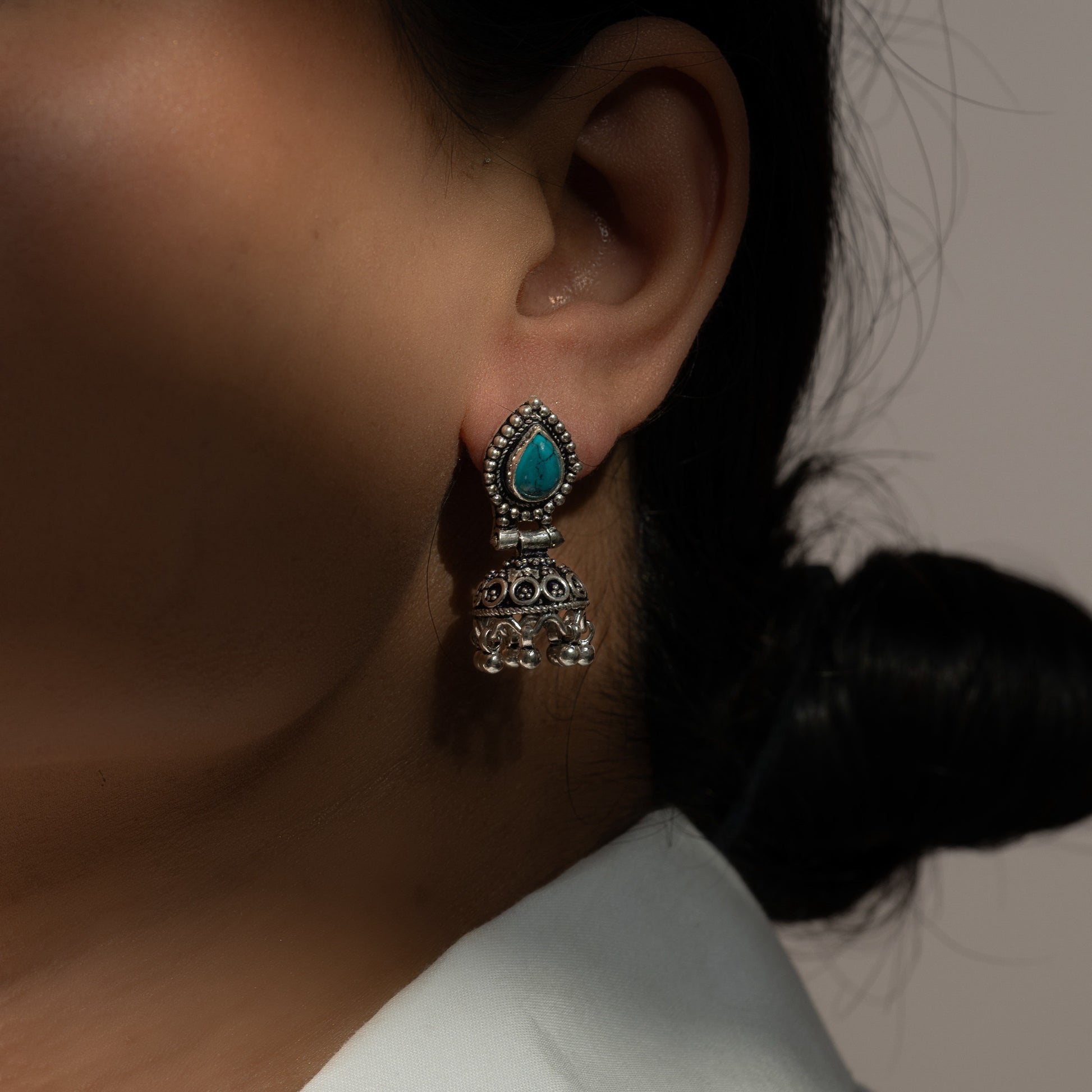 --Intricately designed silver oxidized jhumka earrings with a traditional and vintage-inspired charm.