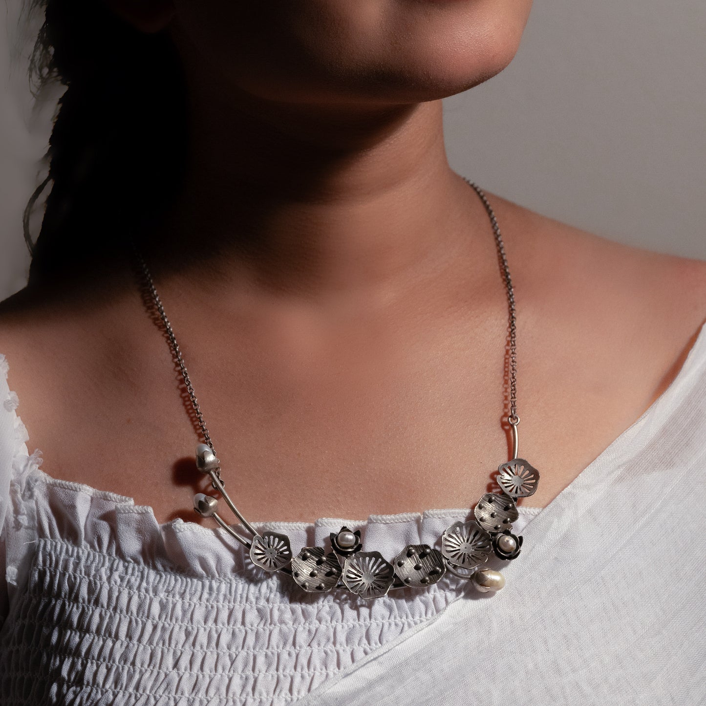 Oxidized sterling silver long necklace with a vintage-inspired charm and a timeless look.