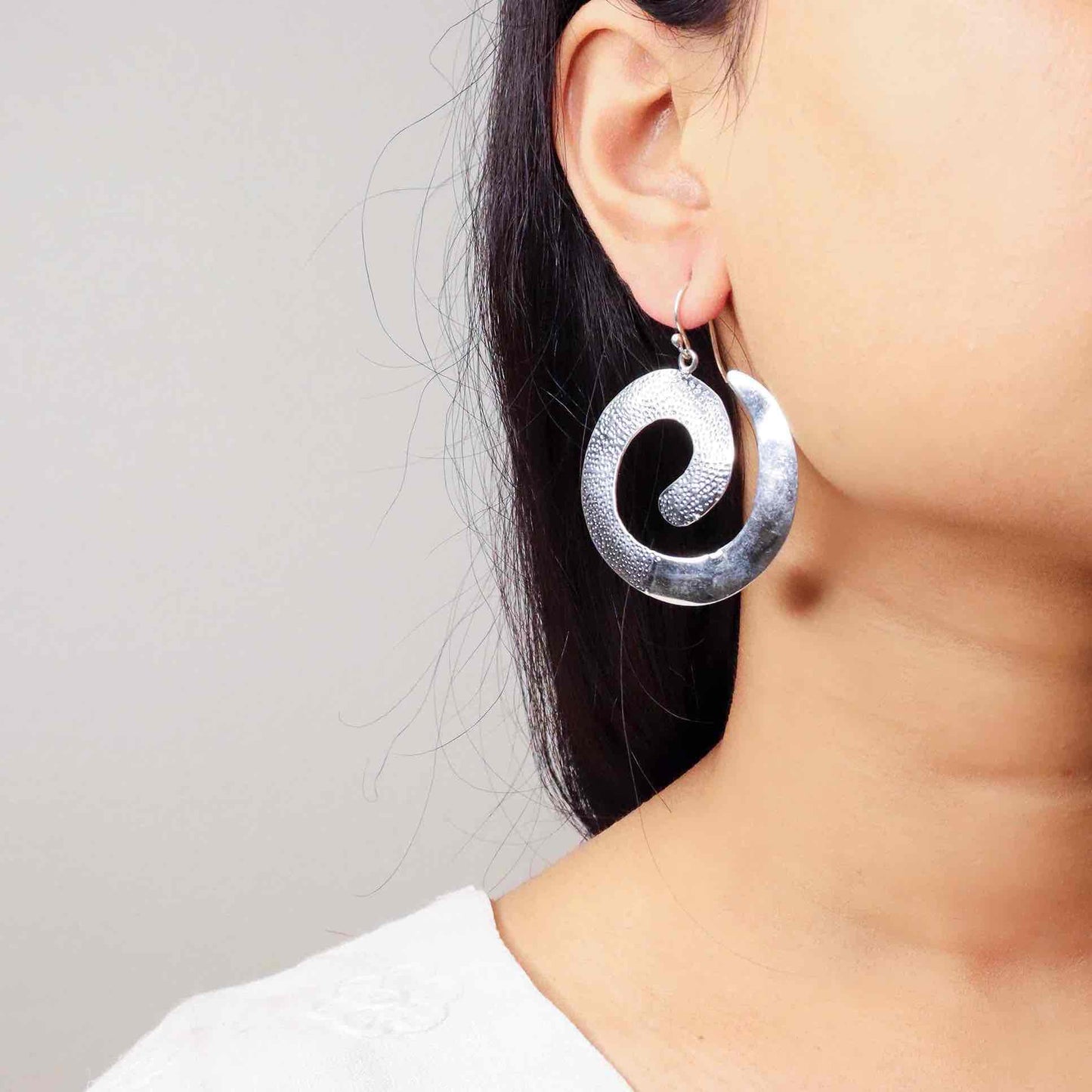 Elegant long silver earrings with a sleek and sophisticated design, perfect for any occasion."