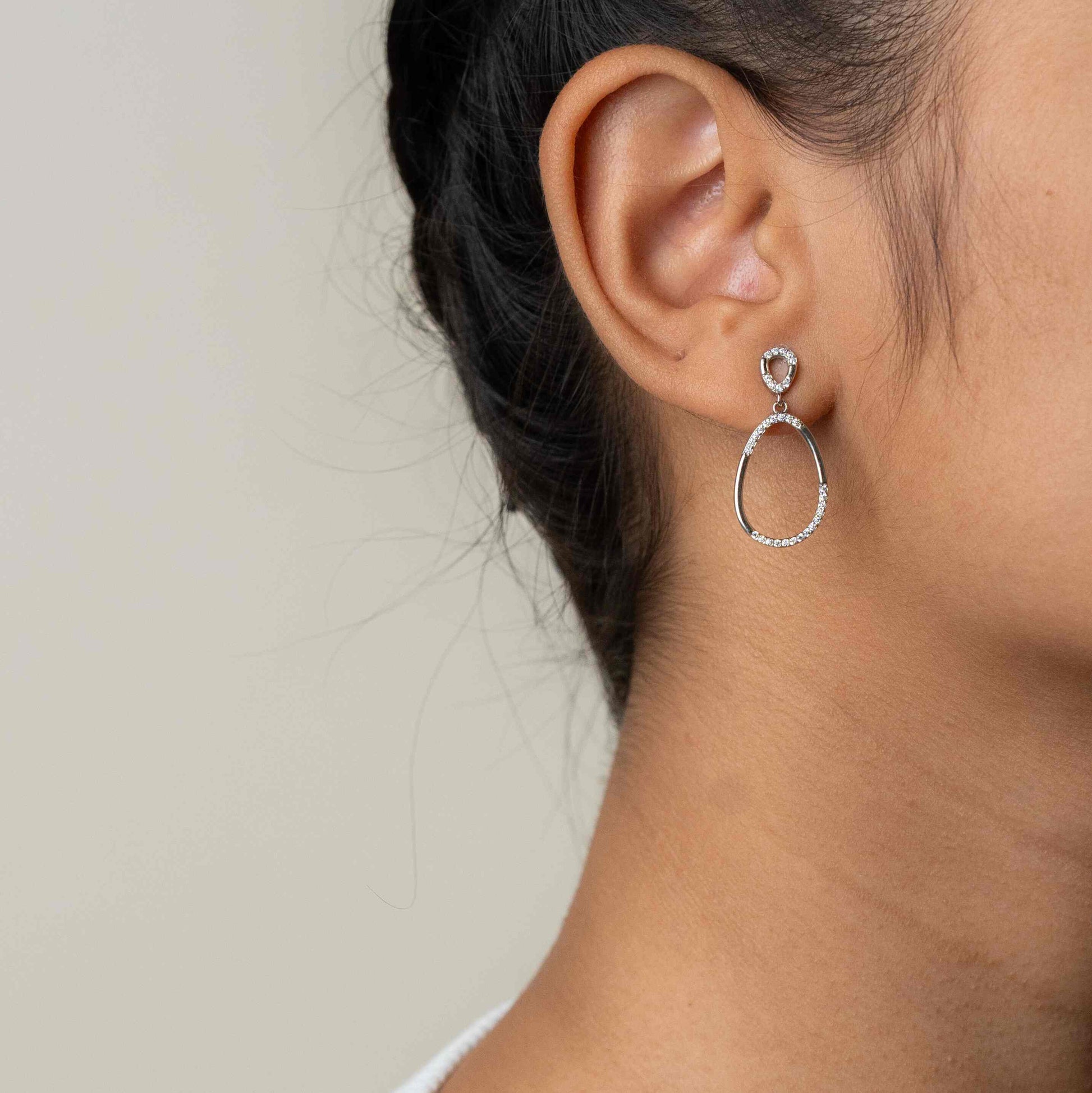 Elegant long silver earrings with a sleek and sophisticated design, perfect for any occasion."