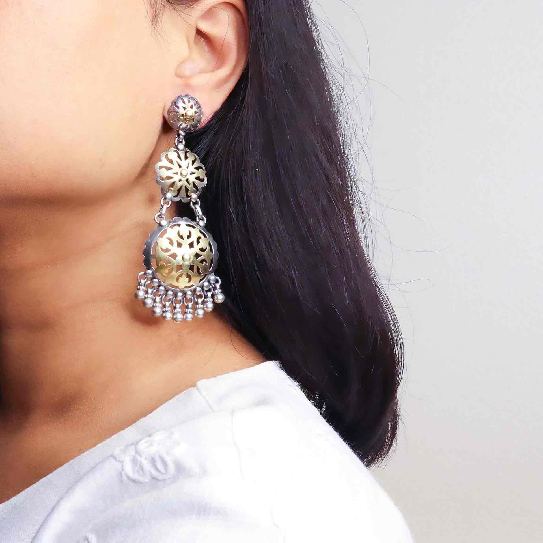 Stunning silver chandbali earrings with intricate detailing, embodying traditional elegance and grace. 