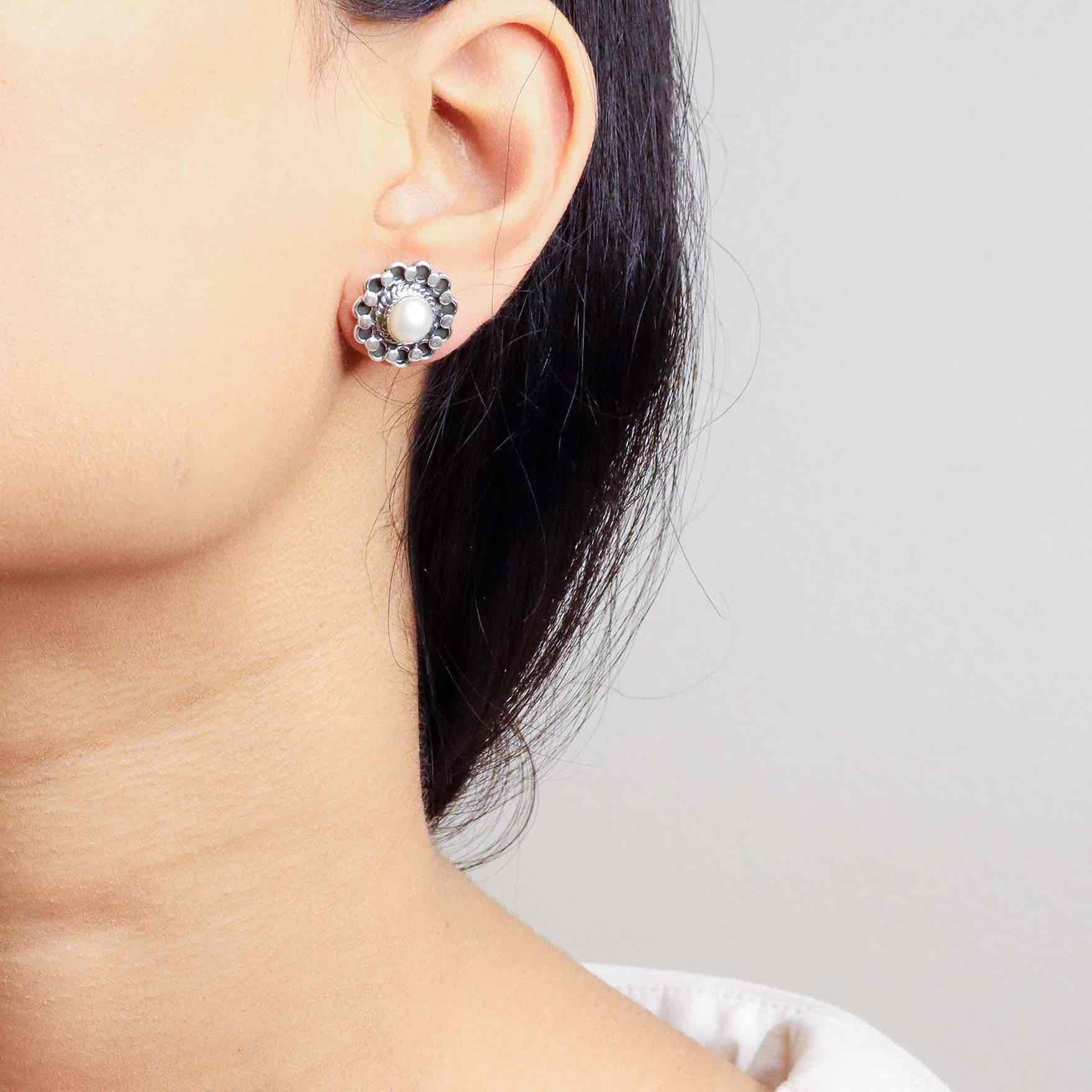 vTimeless silver studs exuding simple elegance and subtle sophistication