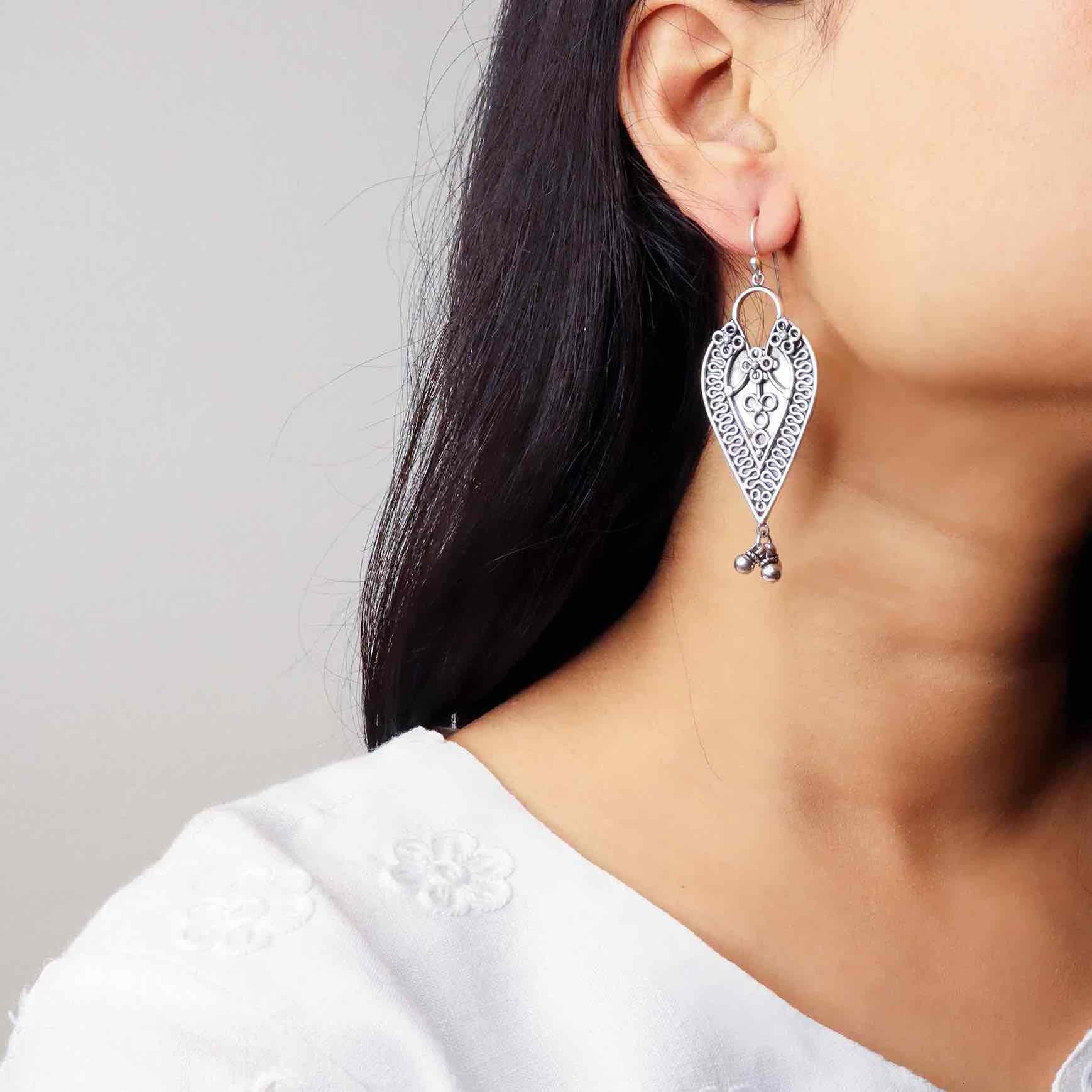 Elegant silver oxidized long earrings with intricate patterns and vintage-inspired charm