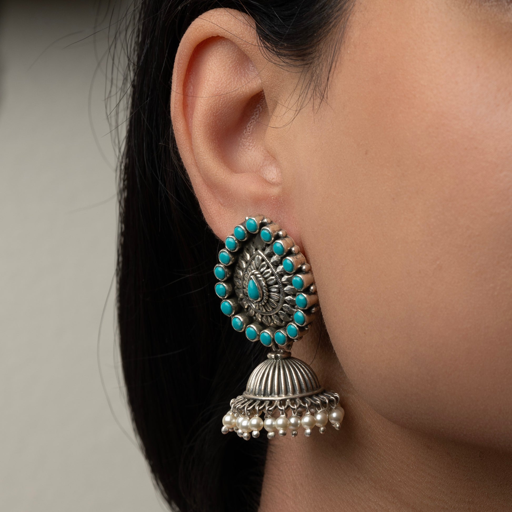 Intricately designed silver oxidized jhumka earrings with a traditional and vintage-inspired charm.