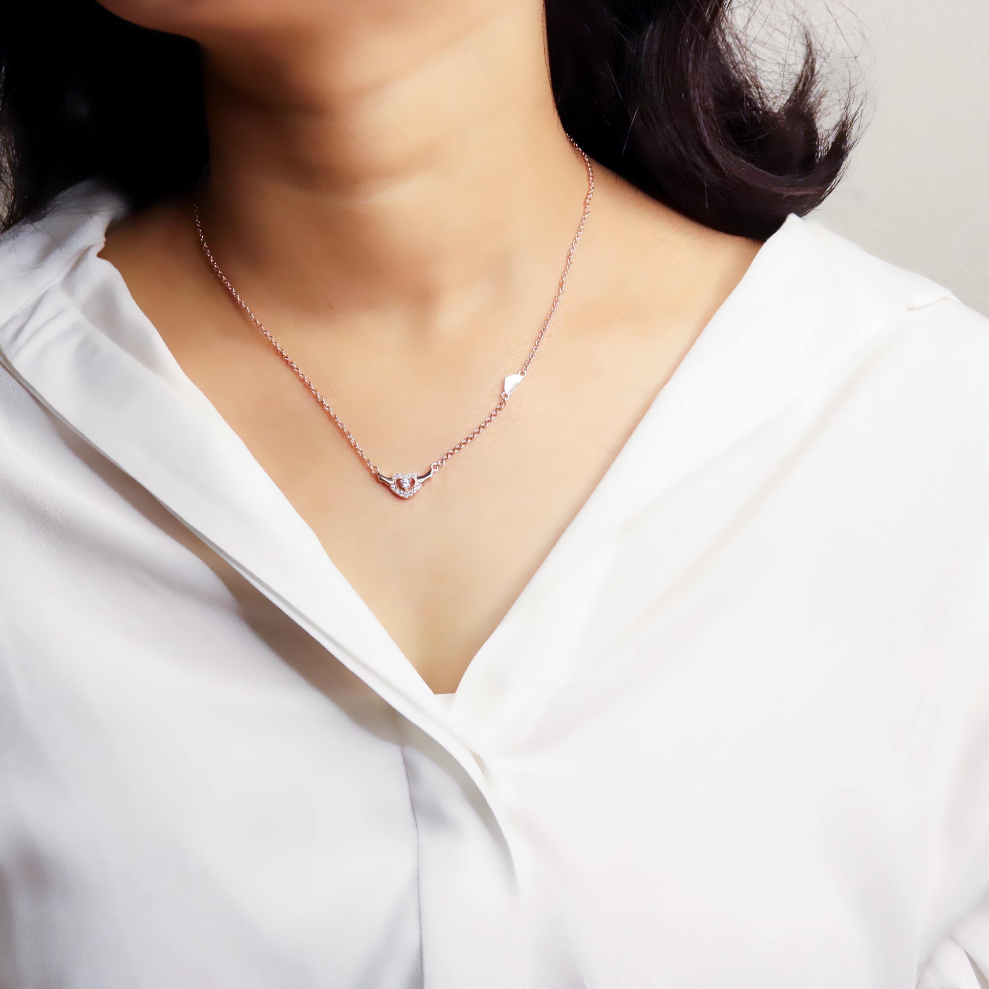 image of a delicate silver chain, showcasing its fine links and shiny, polished finish.