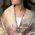 Handcrafted sterling silver long necklace featuring intricate detailing and a polished finish