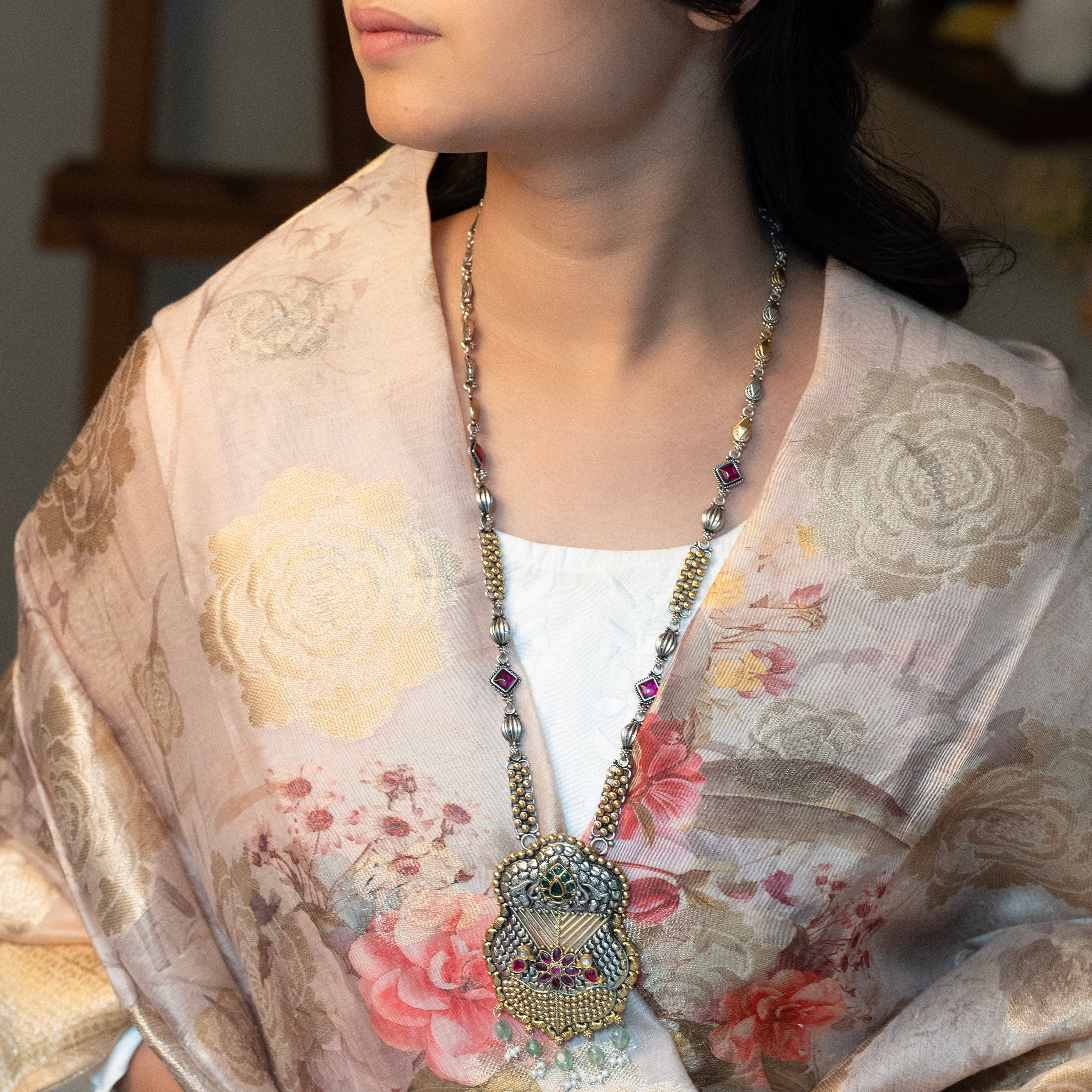 Handcrafted sterling silver long necklace featuring intricate detailing and a polished finish