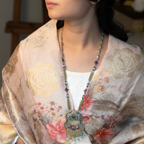 Handcrafted sterling silver long necklace featuring intricate detailing and a polished finish