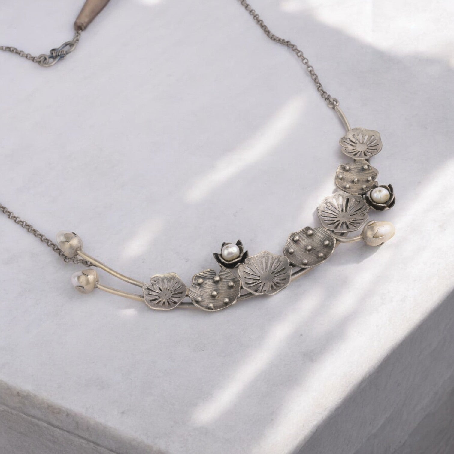 Oxidized sterling silver long necklace with a vintage-inspired charm and a timeless look.