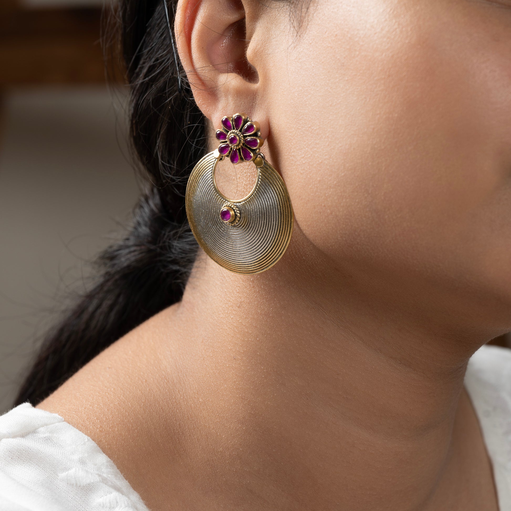 Stunning silver chandbali earrings with intricate detailing, embodying traditional elegance and grace. 