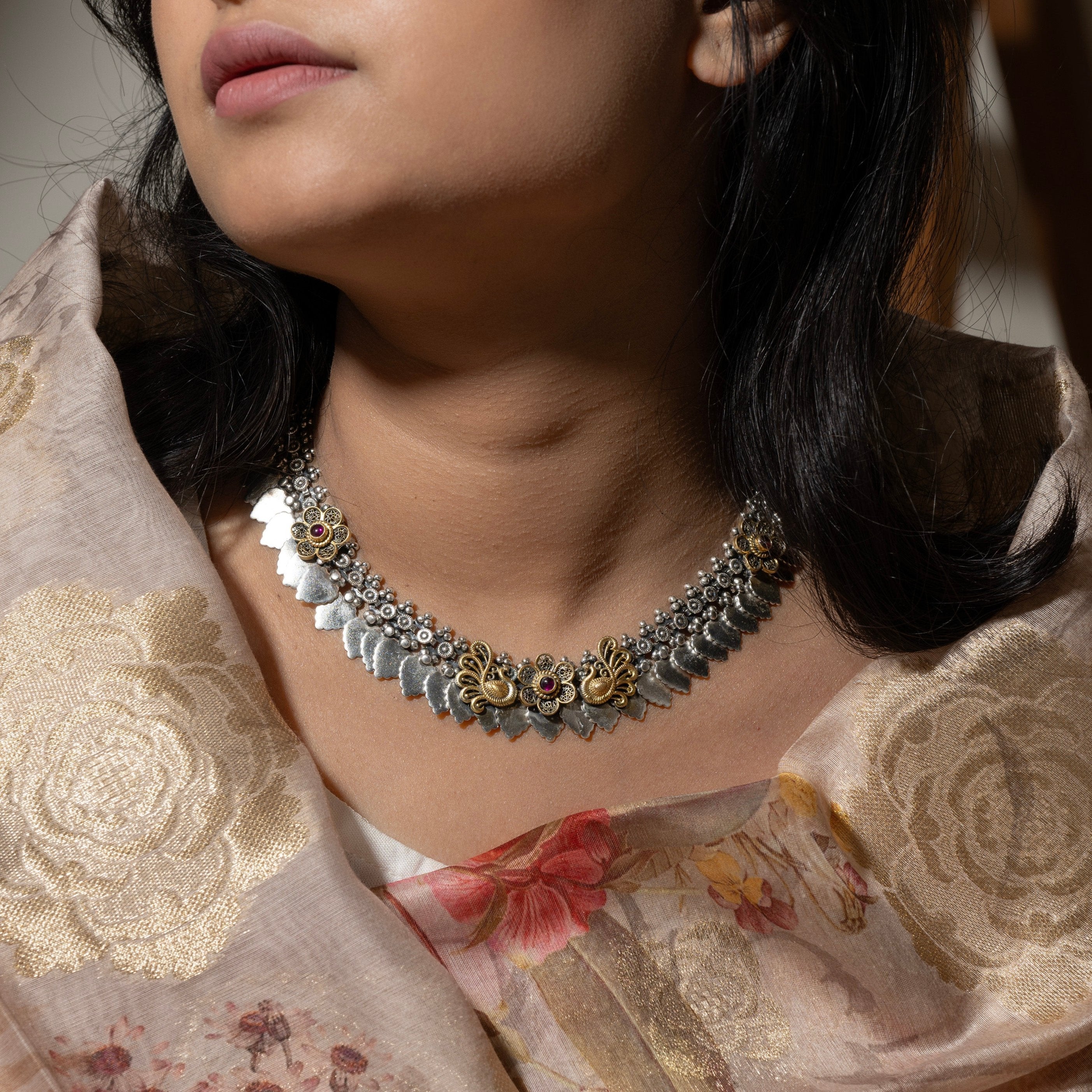 •  Elegant silver choker with intricate filigree design, perfect for traditional and modern outfits