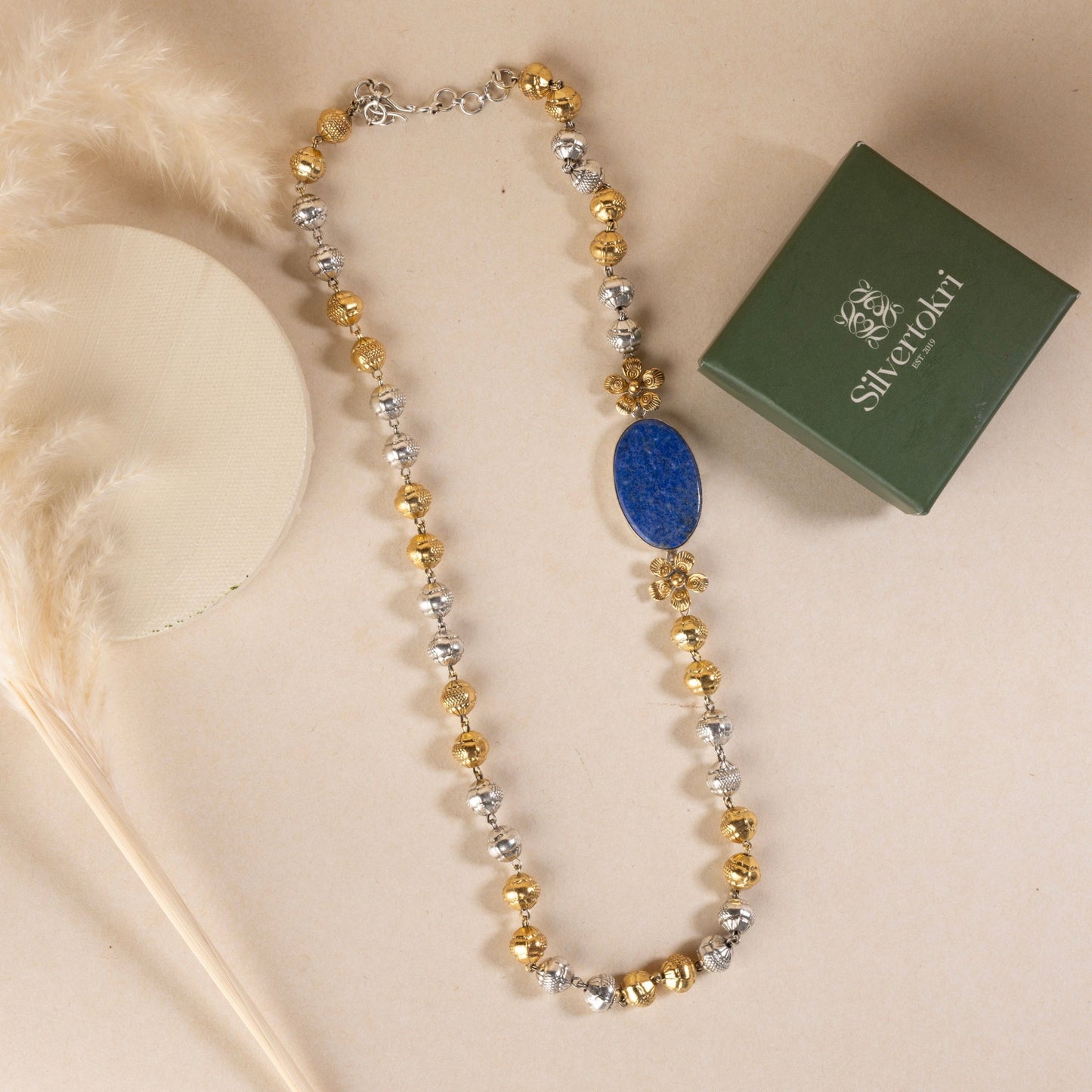 "Long sterling silver necklace with a big blue colour stone, adding a touch of sophistication to any outfit.