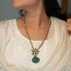 Long sterling silver necklace with a big green colour stone at centre, adding a touch of sophistication to any outfit