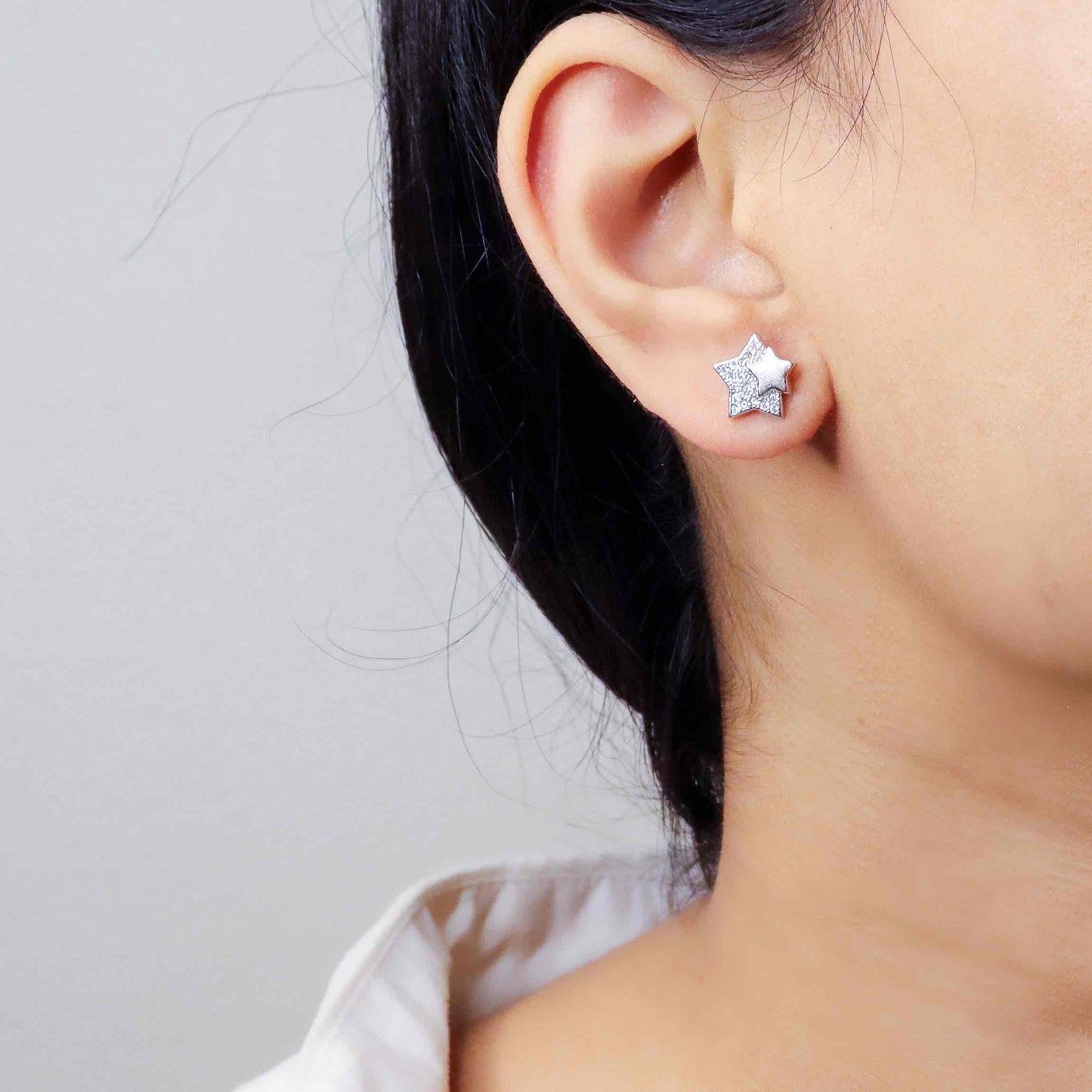 Brilliant cubic zirconia silver studs radiating with classic elegance