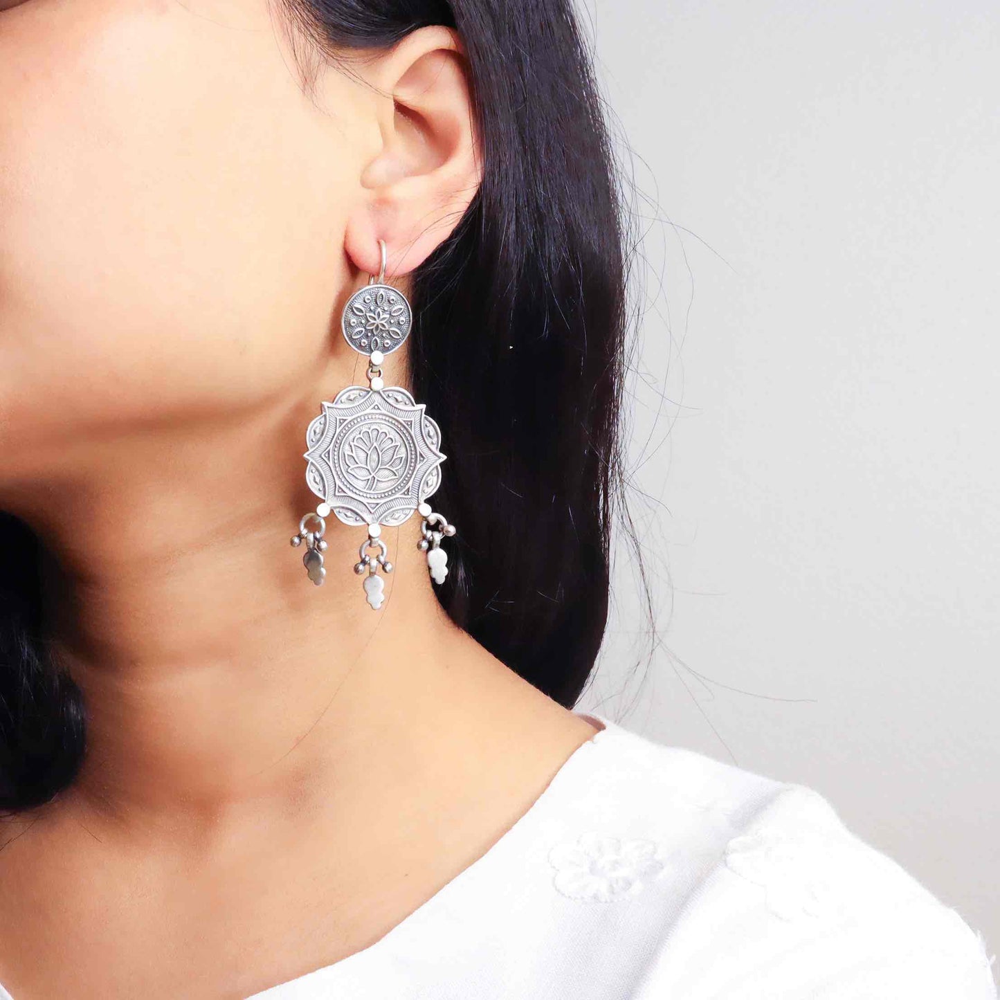 Elegant silver oxidized long earrings with intricate patterns and vintage-inspired charm