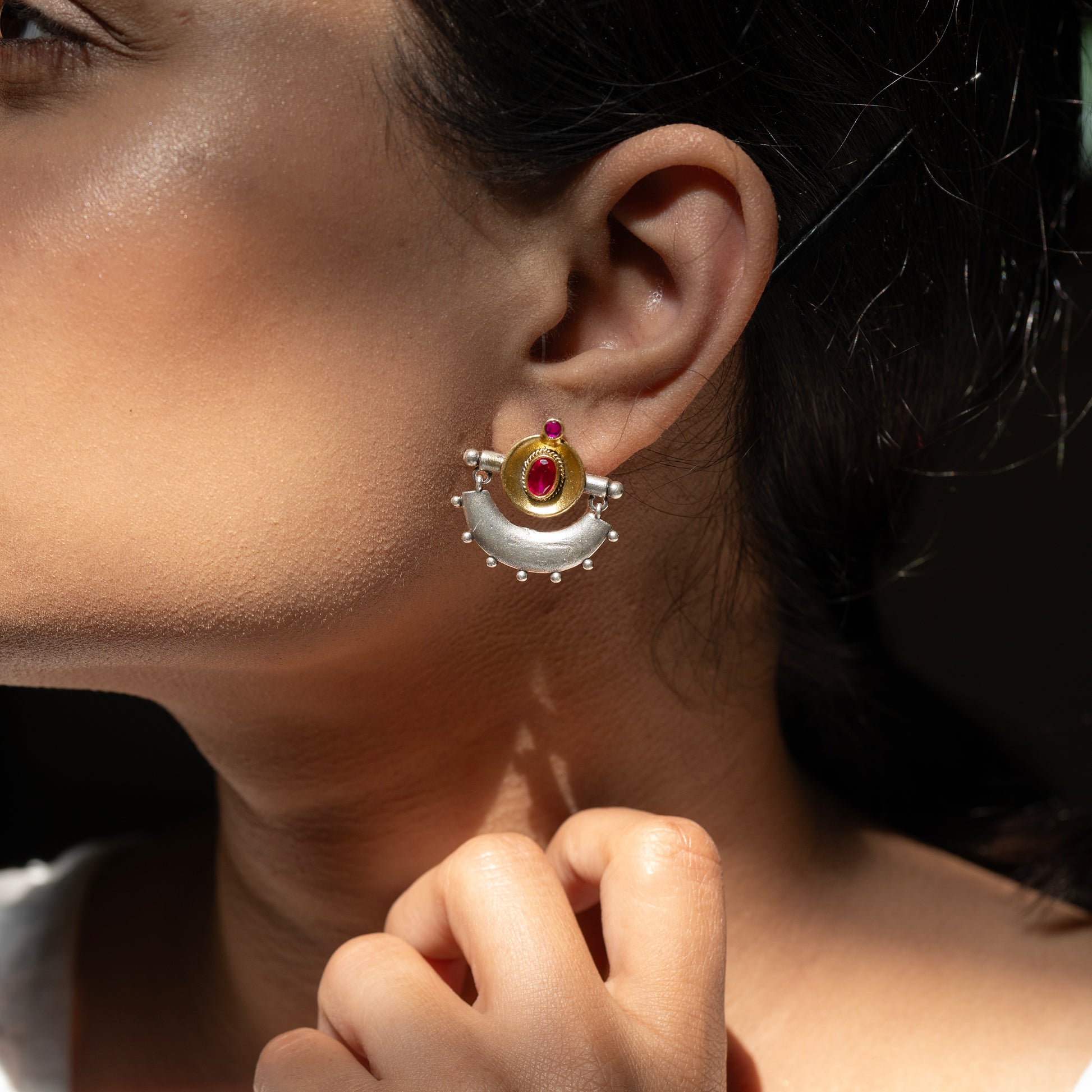 Stunning silver earrings with intricate detailing, embodying traditional elegance and grace. 

