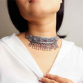 Striking oxidized silver necklace with detailed vintage-inspired patterns, offering a bold, unique look with a timeless, antique finish.
