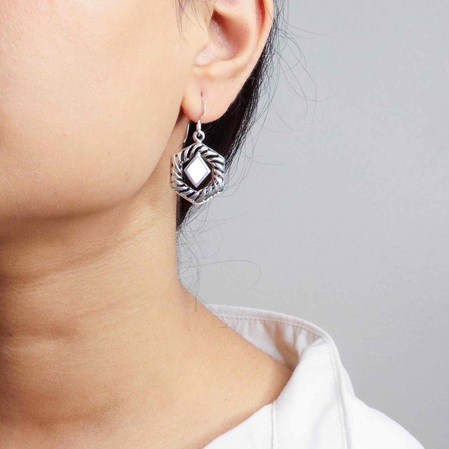 Stylish silver earrings featuring a sleek and modern design for everyday elegance