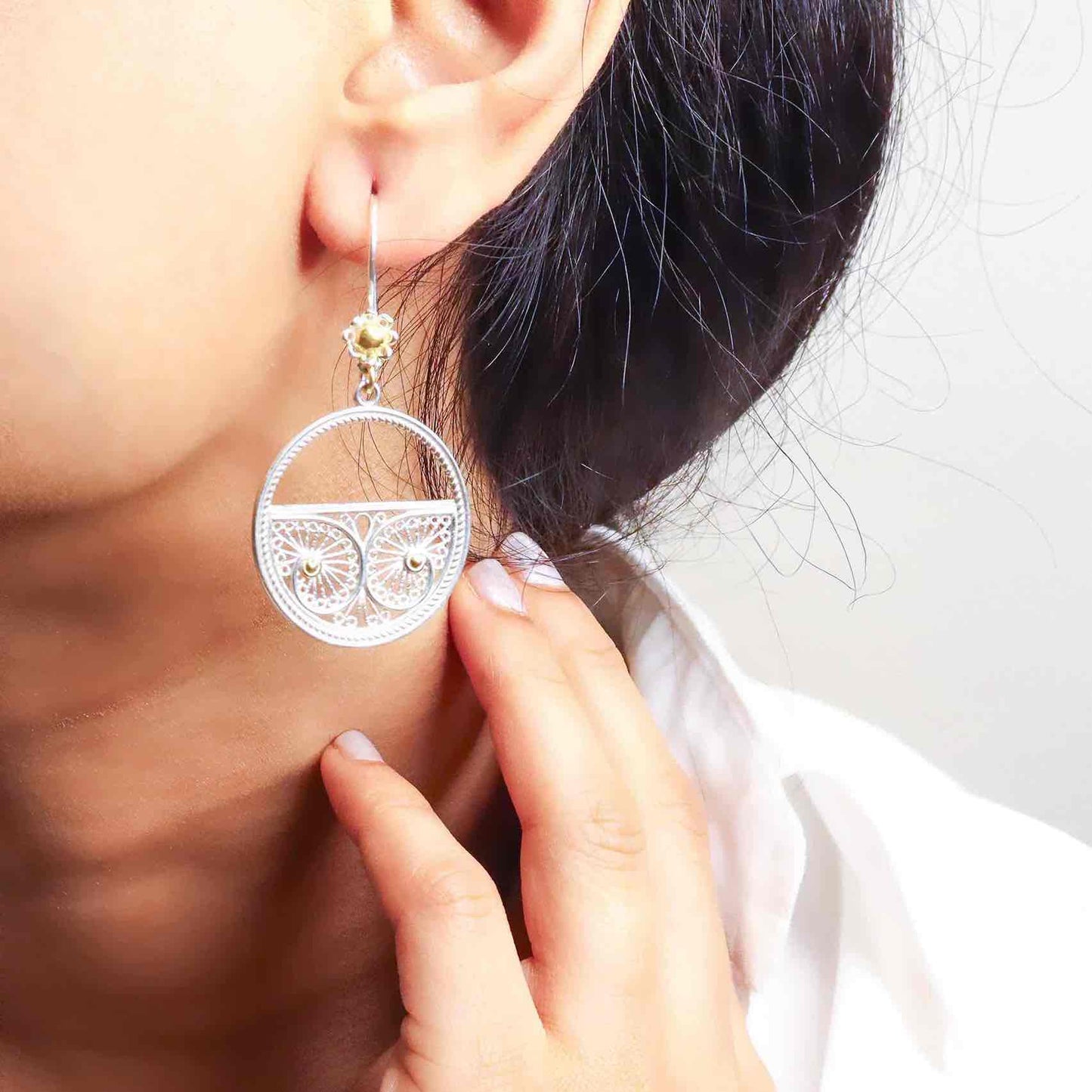 Elegant long silver earrings with a sleek and sophisticated design, perfect for any occasion."