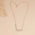 Necklace with a heart-shaped pendant on a beige background