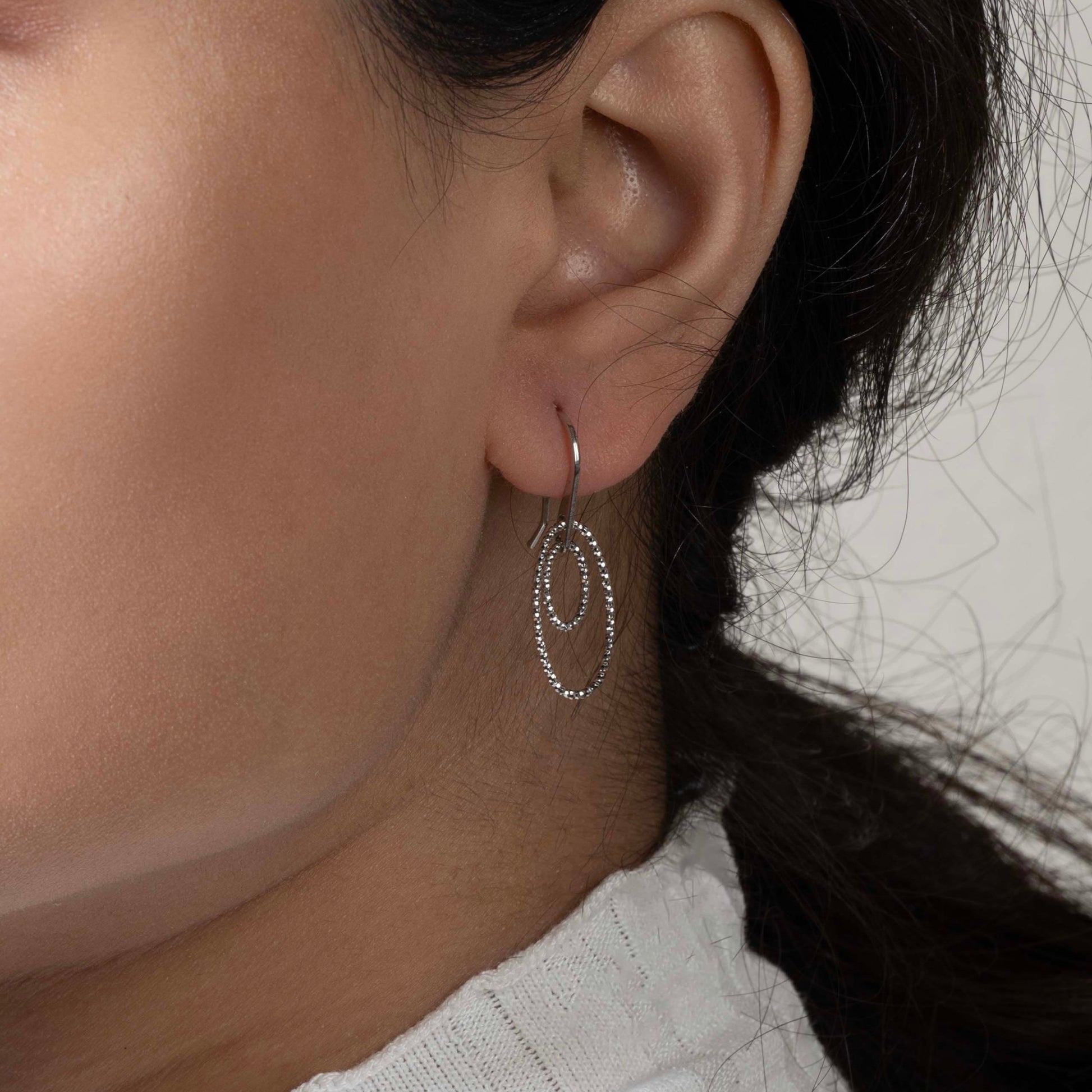 Stylish silver earrings featuring a sleek and modern design for everyday elegance