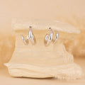 Silver hoops for women
minimal silver earrings for women
valentine gift
latest designs of hoops for women
gift for women
gen z jewellery
gen z jewellery brand
Silver Tokri gen z jewellery

