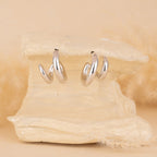 Silver hoops for women
minimal silver earrings for women
valentine gift
latest designs of hoops for women
gift for women
gen z jewellery
gen z jewellery brand
Silver Tokri gen z jewellery

