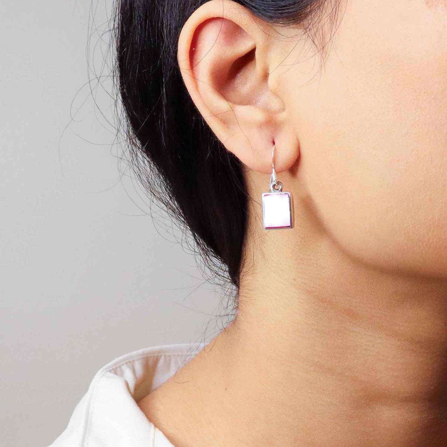 Stylish silver earrings featuring a sleek and modern design for everyday elegance