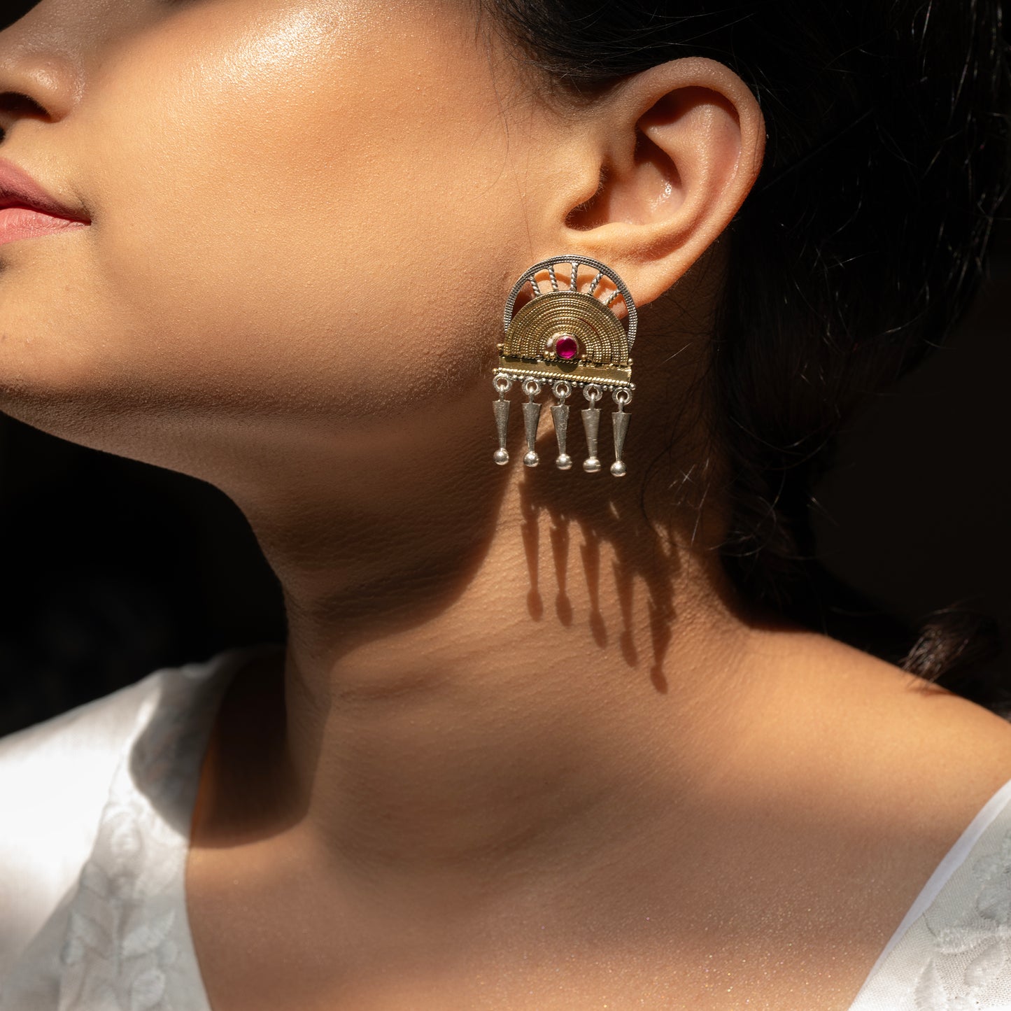 Stunning silver earrings with intricate detailing, embodying traditional elegance and grace. 