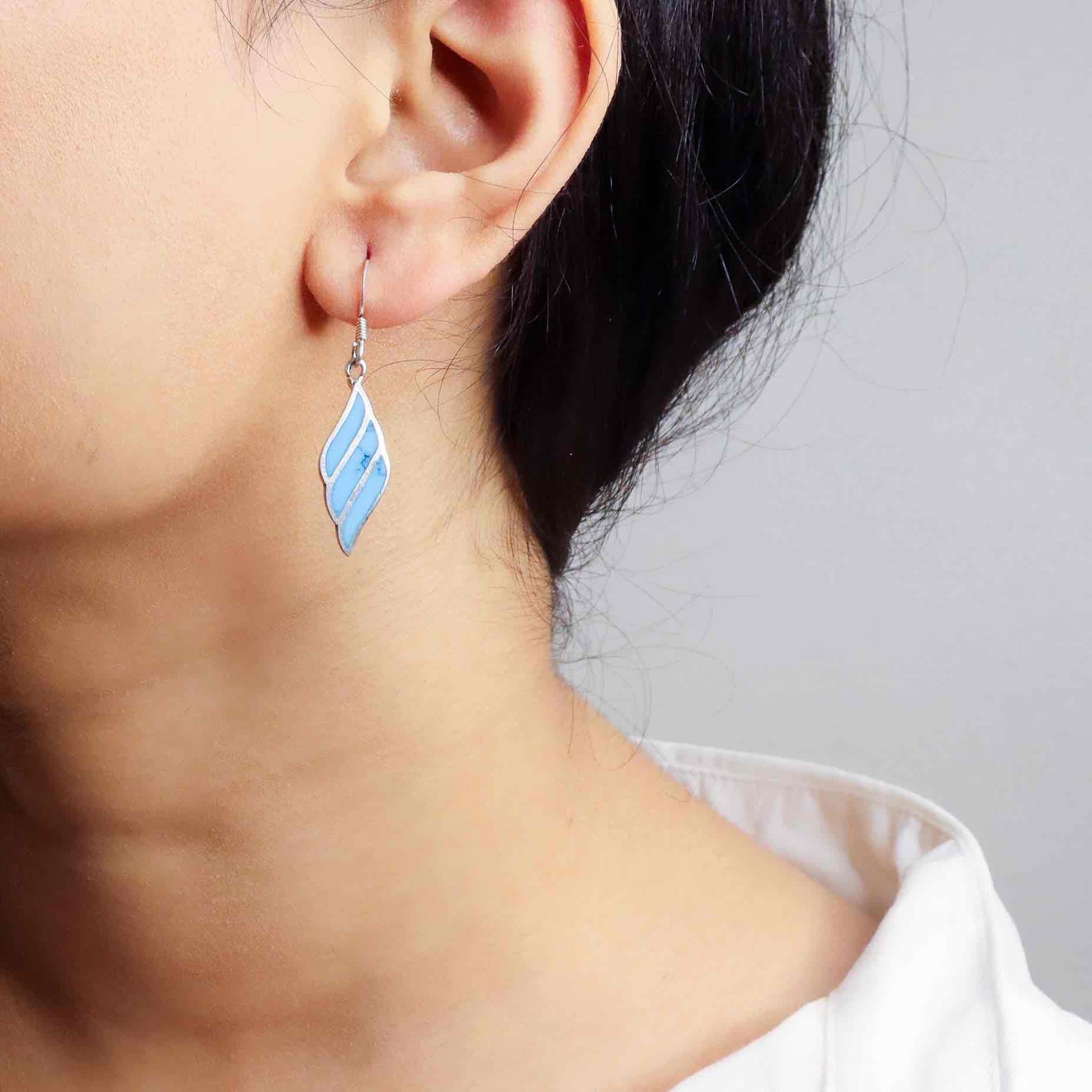 Stylish silver earrings featuring a sleek and modern design for everyday elegance