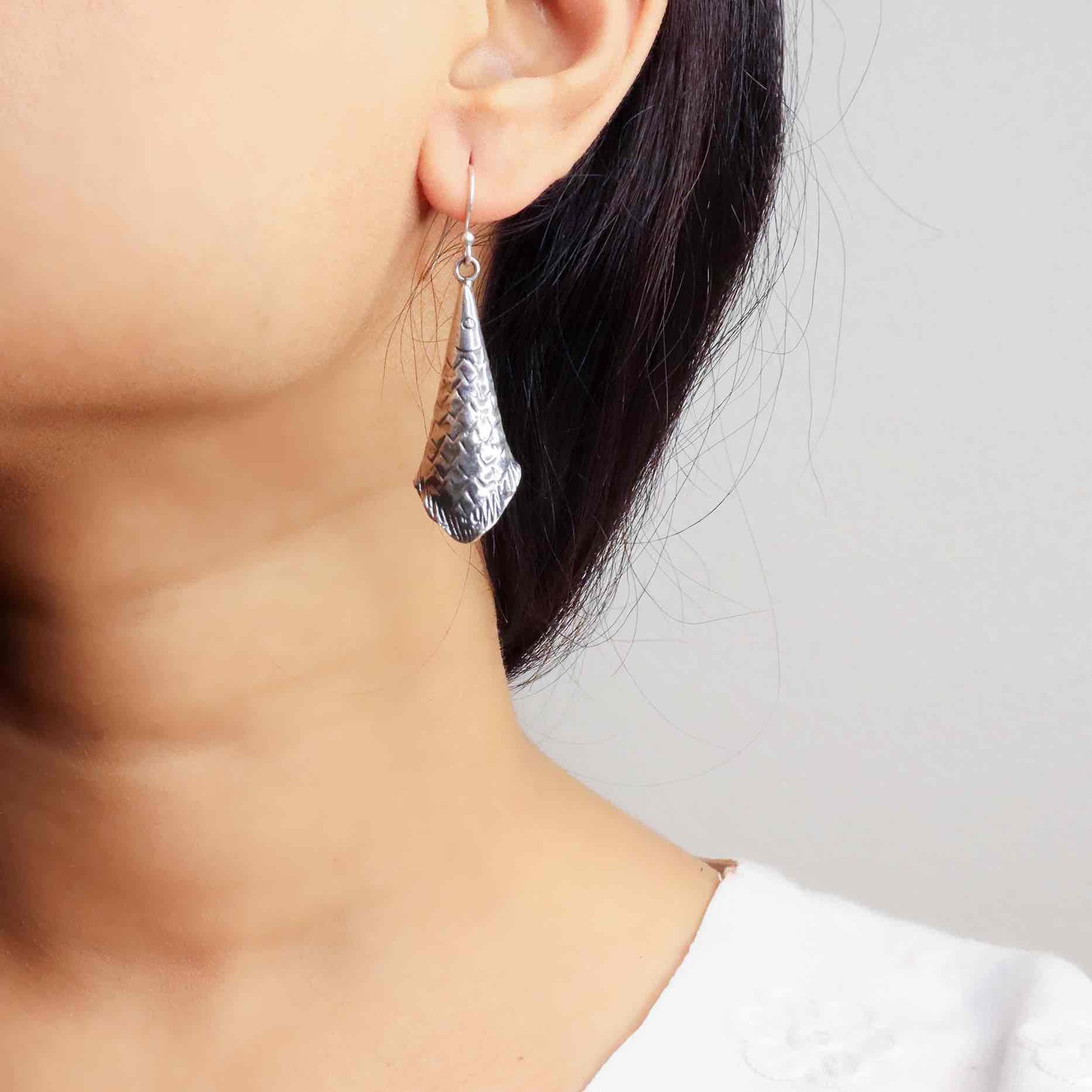 Elegant silver oxidized long earrings with intricate patterns and vintage-inspired charm