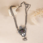 Oxidized sterling silver long necklace with a vintage-inspired charm and a timeless look.