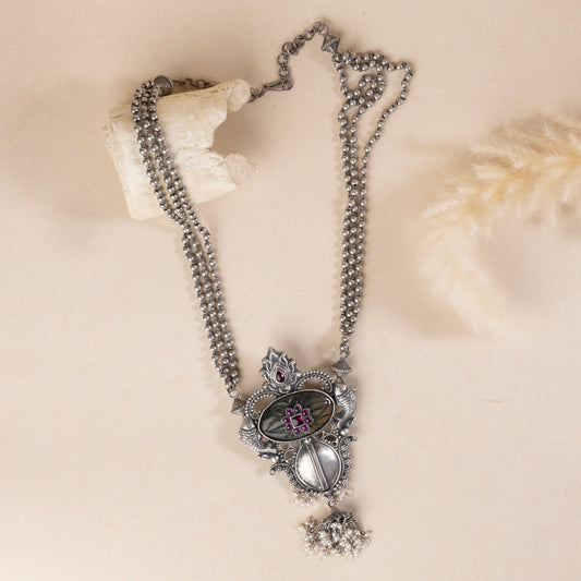 Oxidized sterling silver long necklace with a vintage-inspired charm and a timeless look.