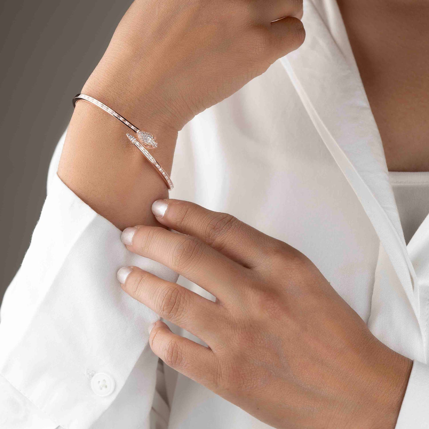 Stylish silver bracelet with a snake design, featuring a sleek and modern look perfect for women seeking a unique and elegant accessory