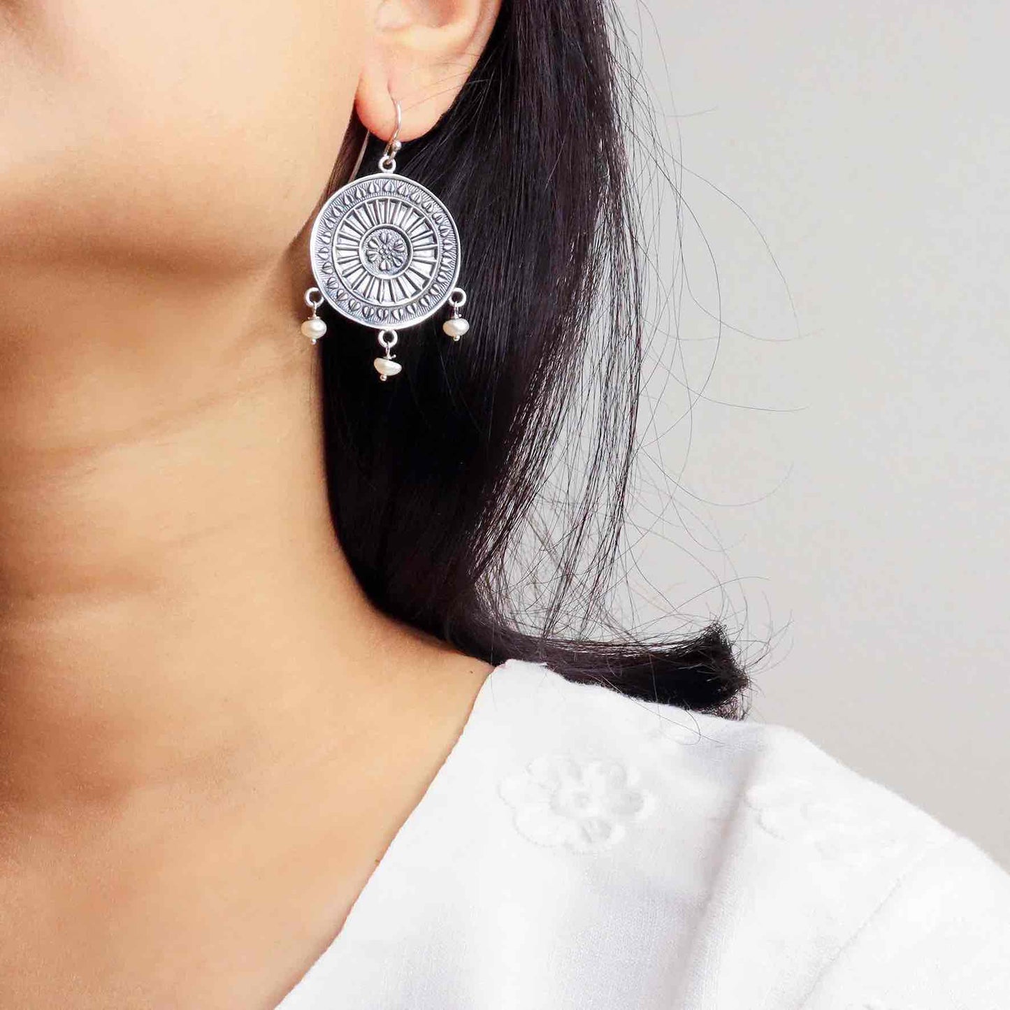 Elegant silver oxidized long earrings with intricate patterns and vintage-inspired charm