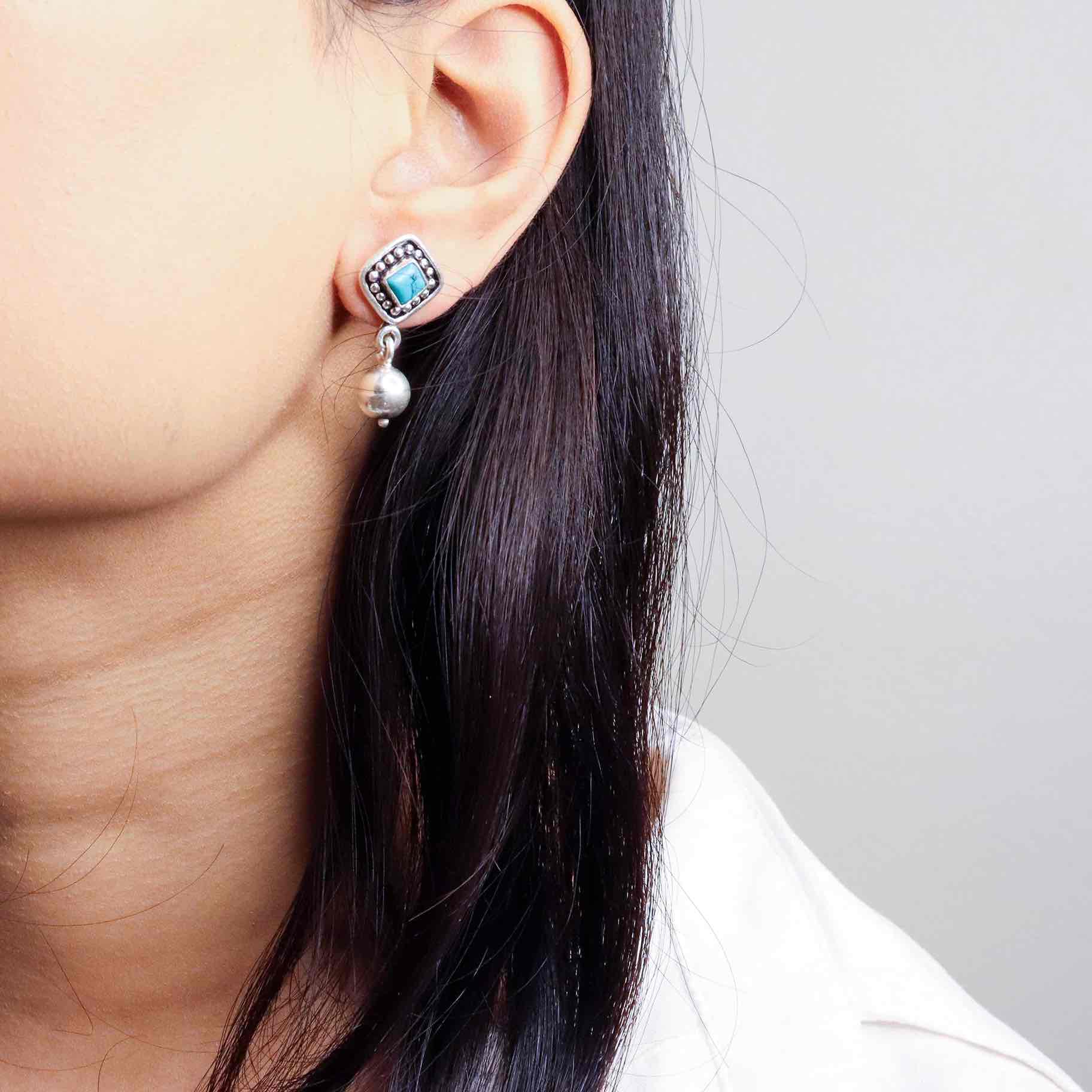 Stylish silver earrings featuring a sleek and modern design for everyday elegance