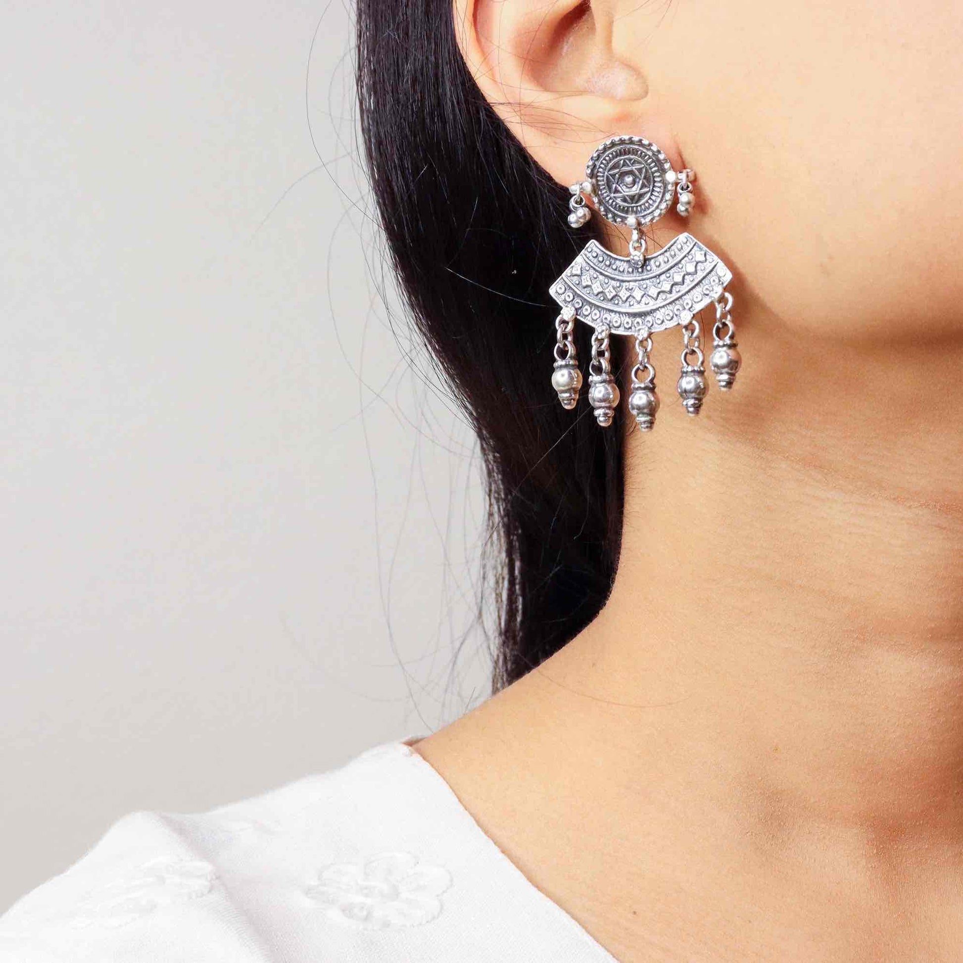 Elegant silver oxidized long earrings with intricate patterns and vintage-inspired charm