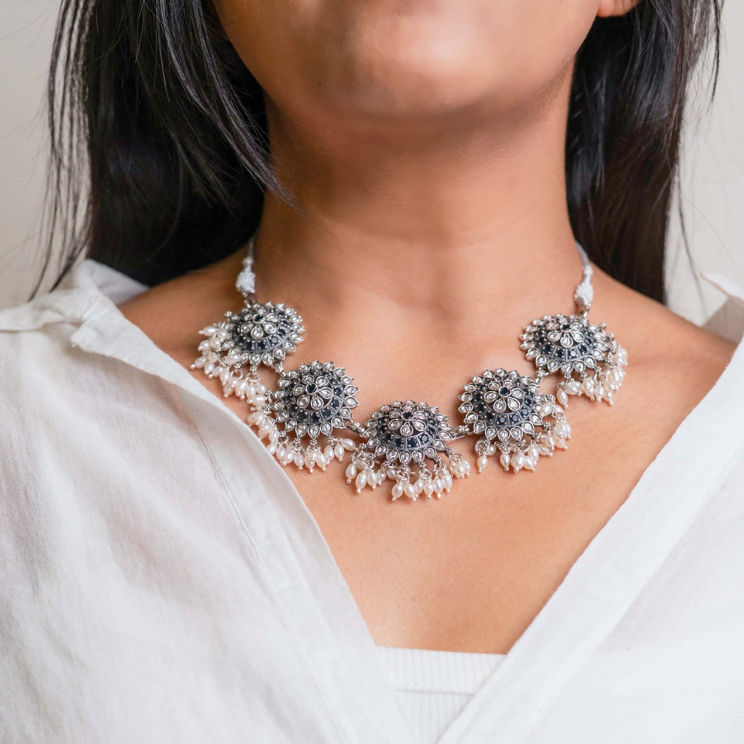 Beautiful oxidized silver choker with intricate patterns and a vintage finish, offering a bold, antique look for statement styling.
