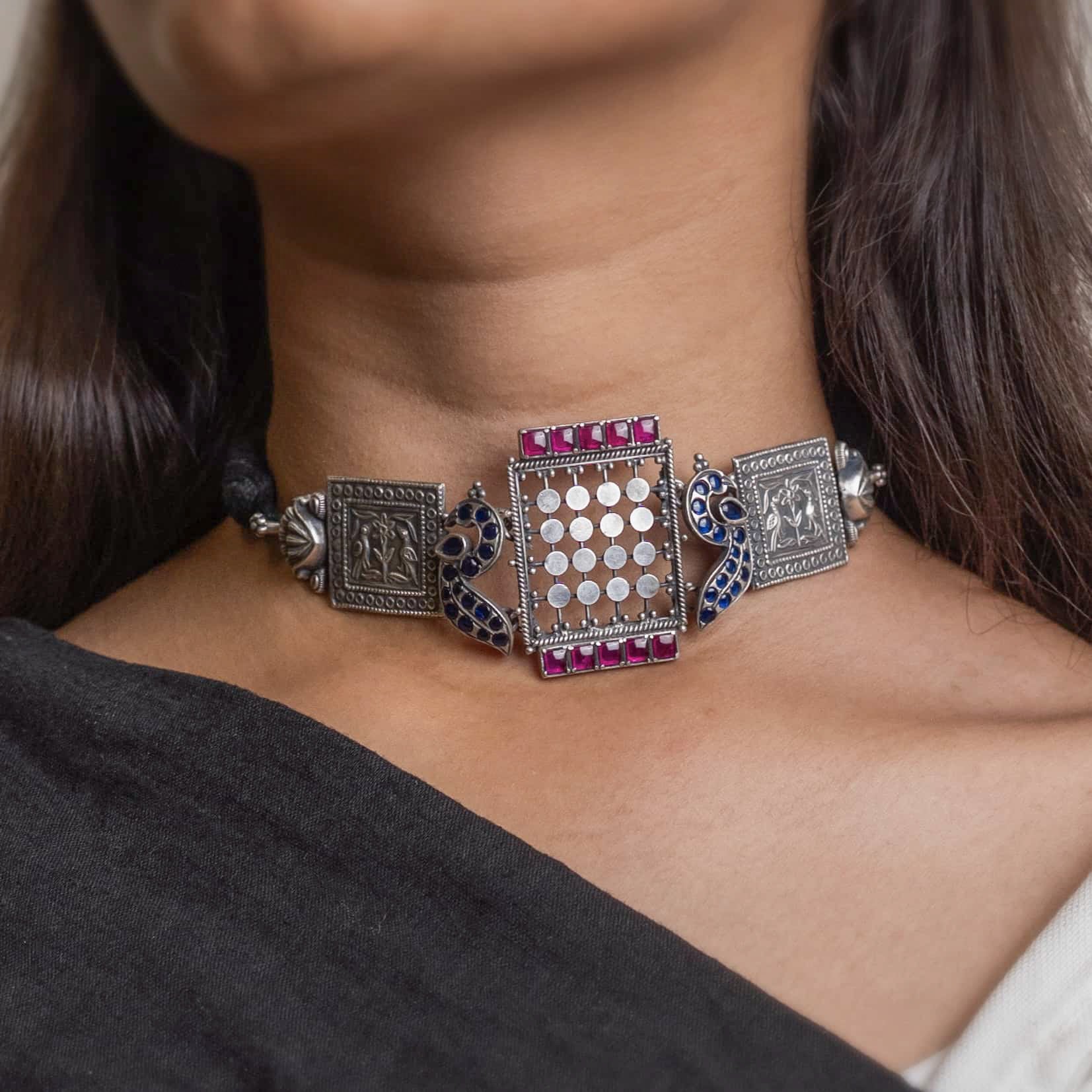 Beautiful oxidized silver choker with intricate patterns and a vintage finish, offering a bold, antique look for statement styling.
