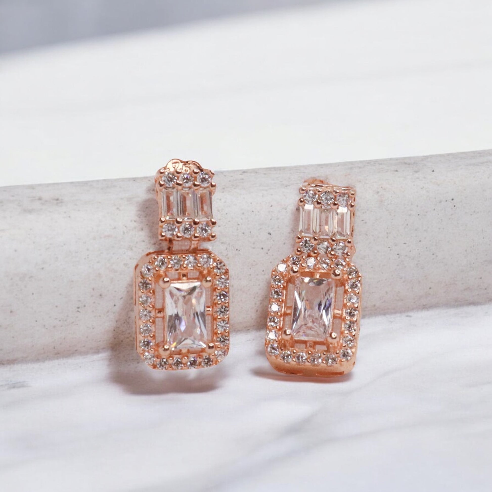 Elegant rose gold cubic zirconia silver studs sparkling with timeless sophistication.