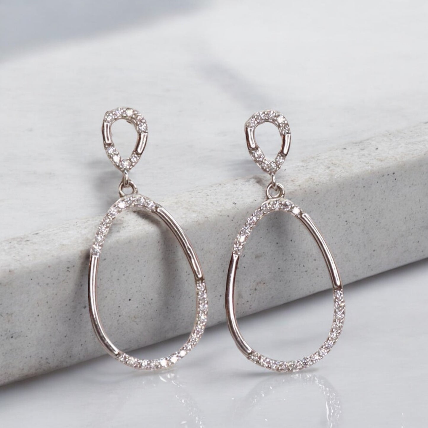 Stylish silver earrings featuring a sleek and modern design for everyday elegance