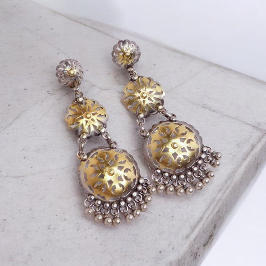 Stunning silver chandbali earrings with intricate detailing, embodying traditional elegance and grace. 