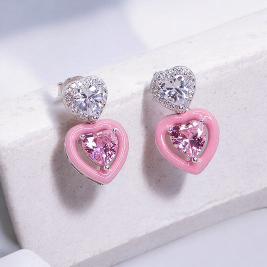 Stylish heart shape silver earrings featuring a sleek and modern design for everyday elegance