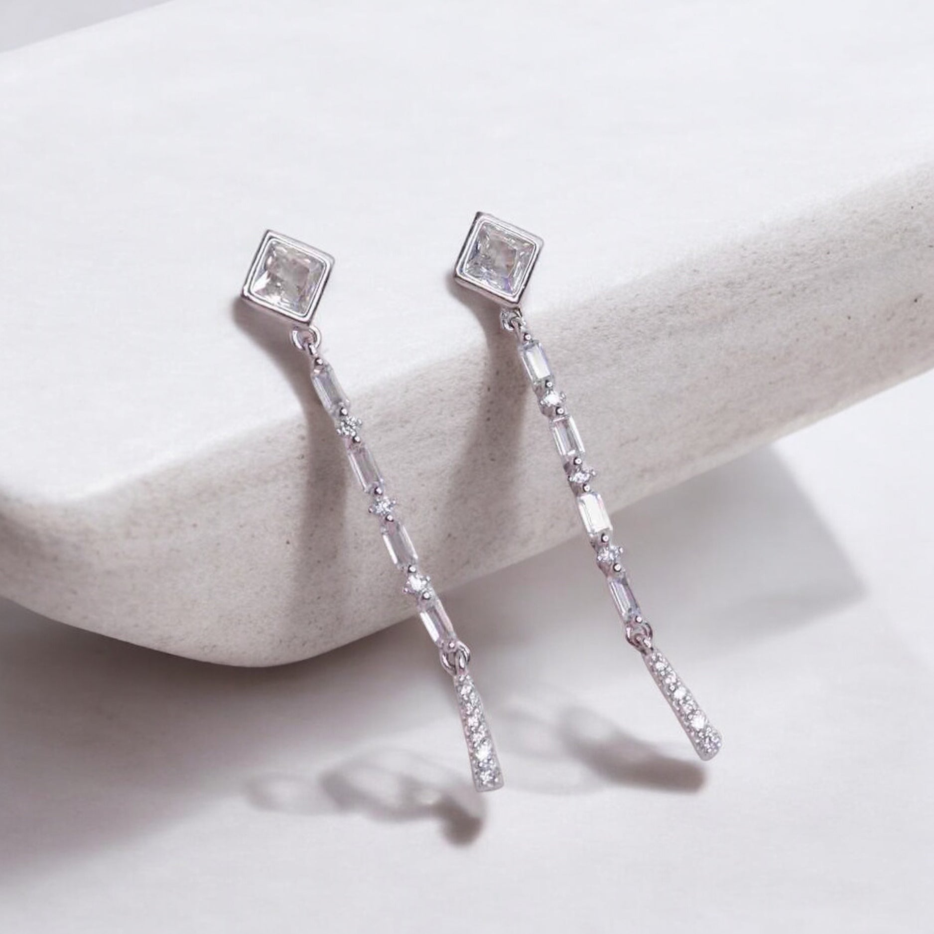 Stylish silver earrings featuring a sleek and modern design for elegant look