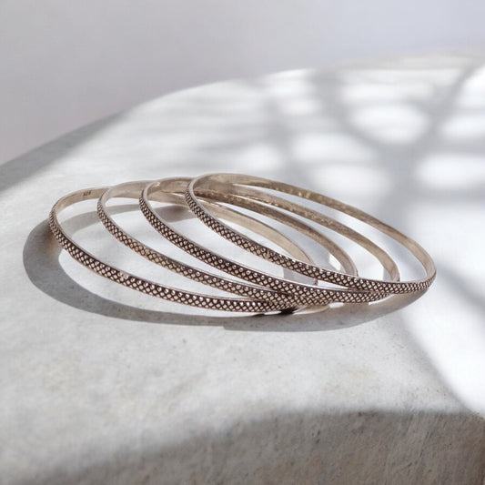 Beautiful oxidized silver bangles for women, showcasing intricate designs and a vintage-inspired charm, ideal for a bold and elegant style statement.

