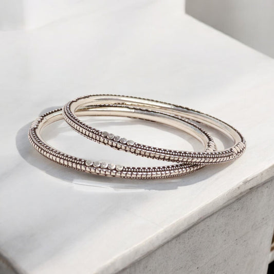 Beautiful oxidized silver bangles for women, showcasing intricate designs and a vintage-inspired charm, ideal for a bold and elegant style statement.

