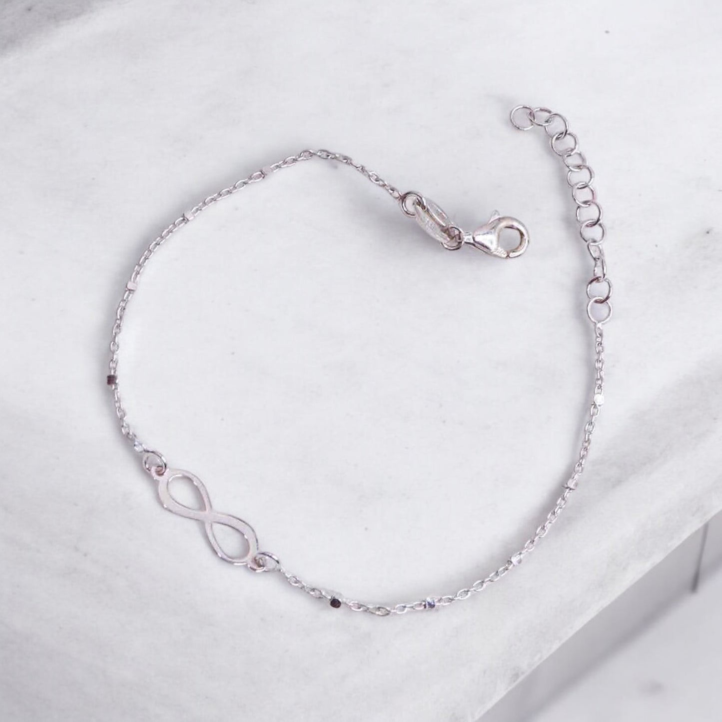 Elegant silver hand cuff or bracelet for women, featuring a sleek and sophisticated design, perfect for adding a touch of refinement to any outfit.
