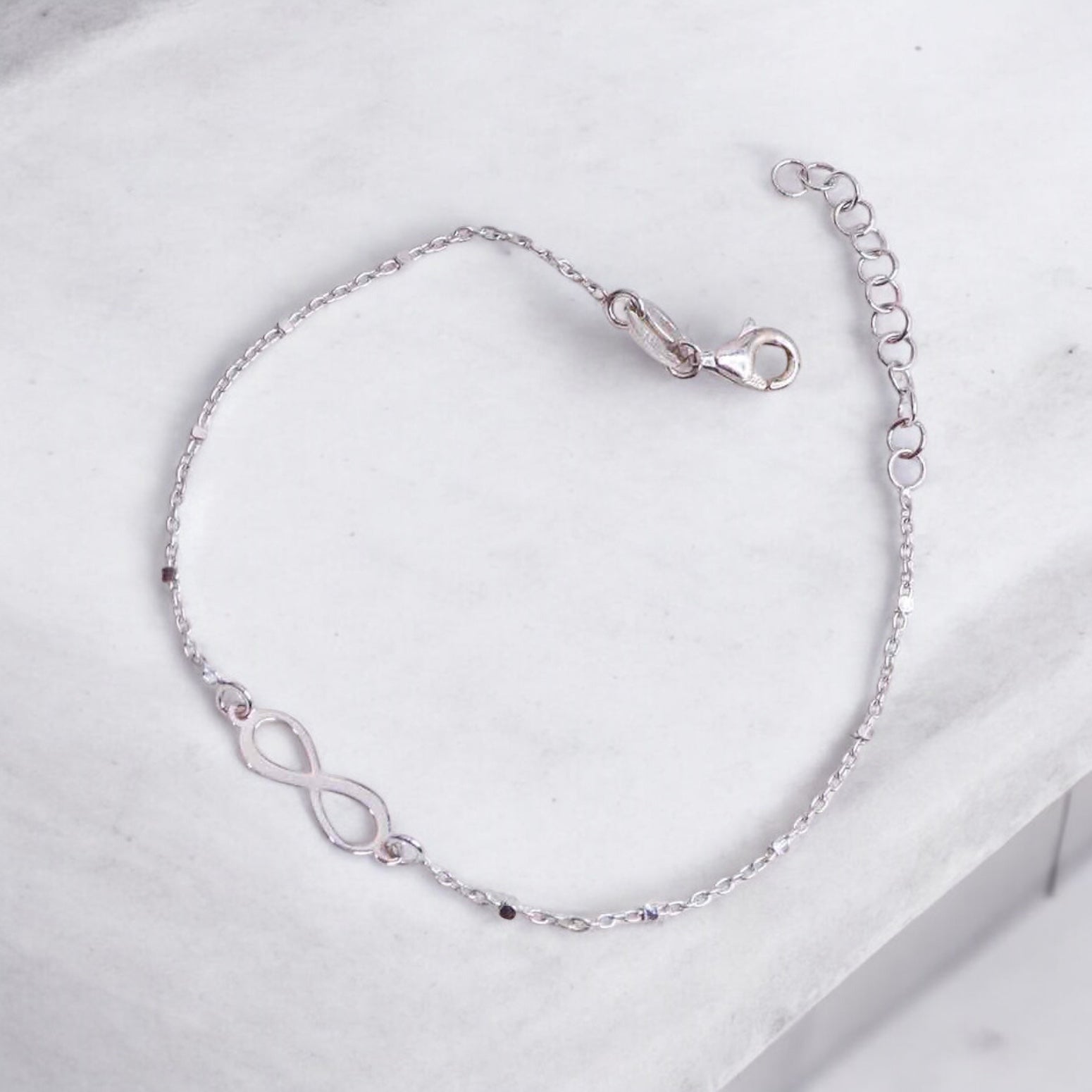 Elegant silver hand cuff or bracelet for women, featuring a sleek and sophisticated design, perfect for adding a touch of refinement to any outfit.
